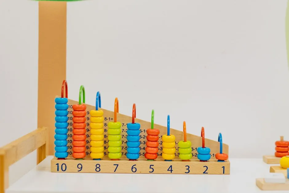 A wooden counting abacus toy on a shelf in a daycare classroom, no children or text visible